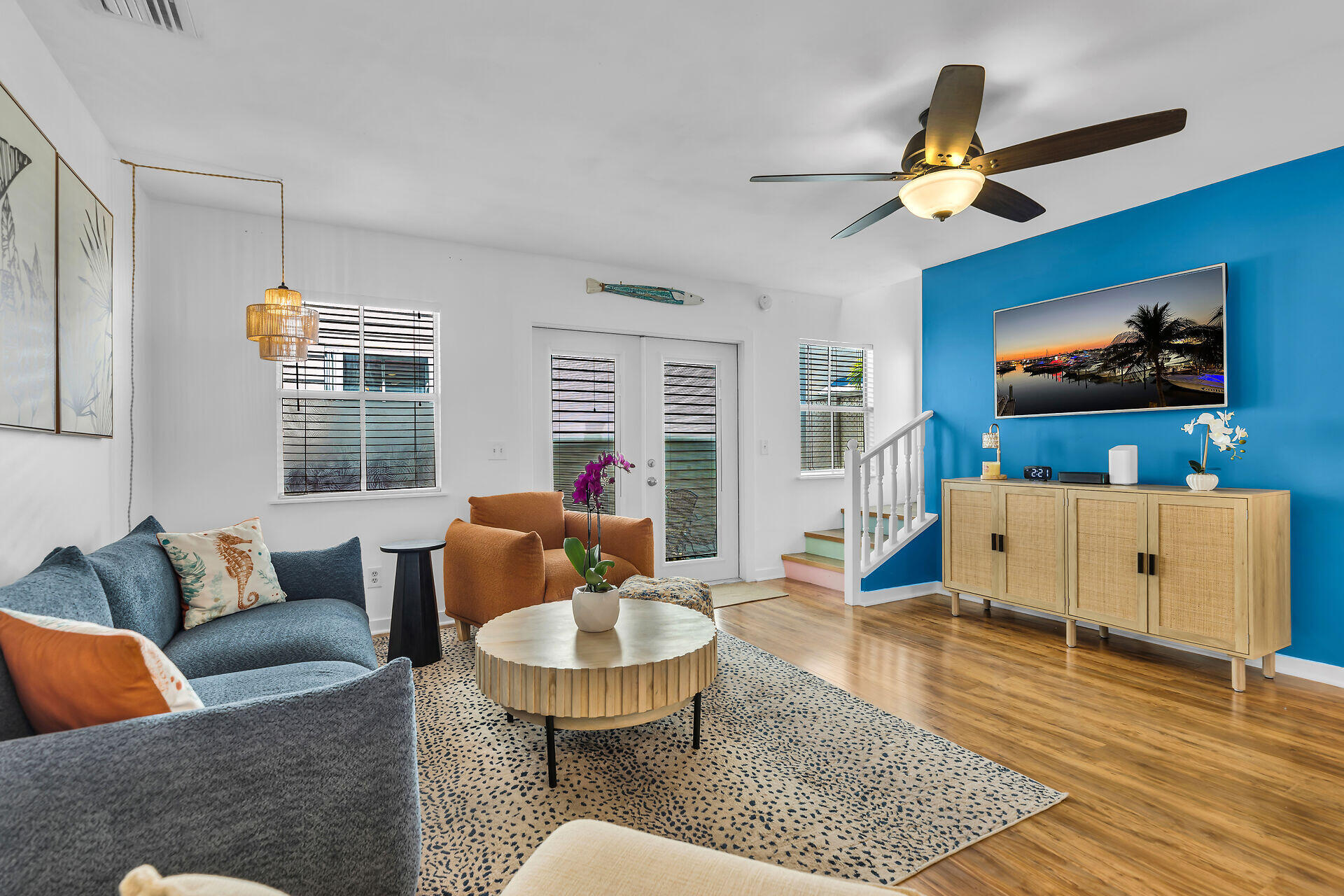 1075 Duval Street, Unit R10 Key West, FL 33040 - Photo 19 of 38 a living room with furniture and a flat screen tv