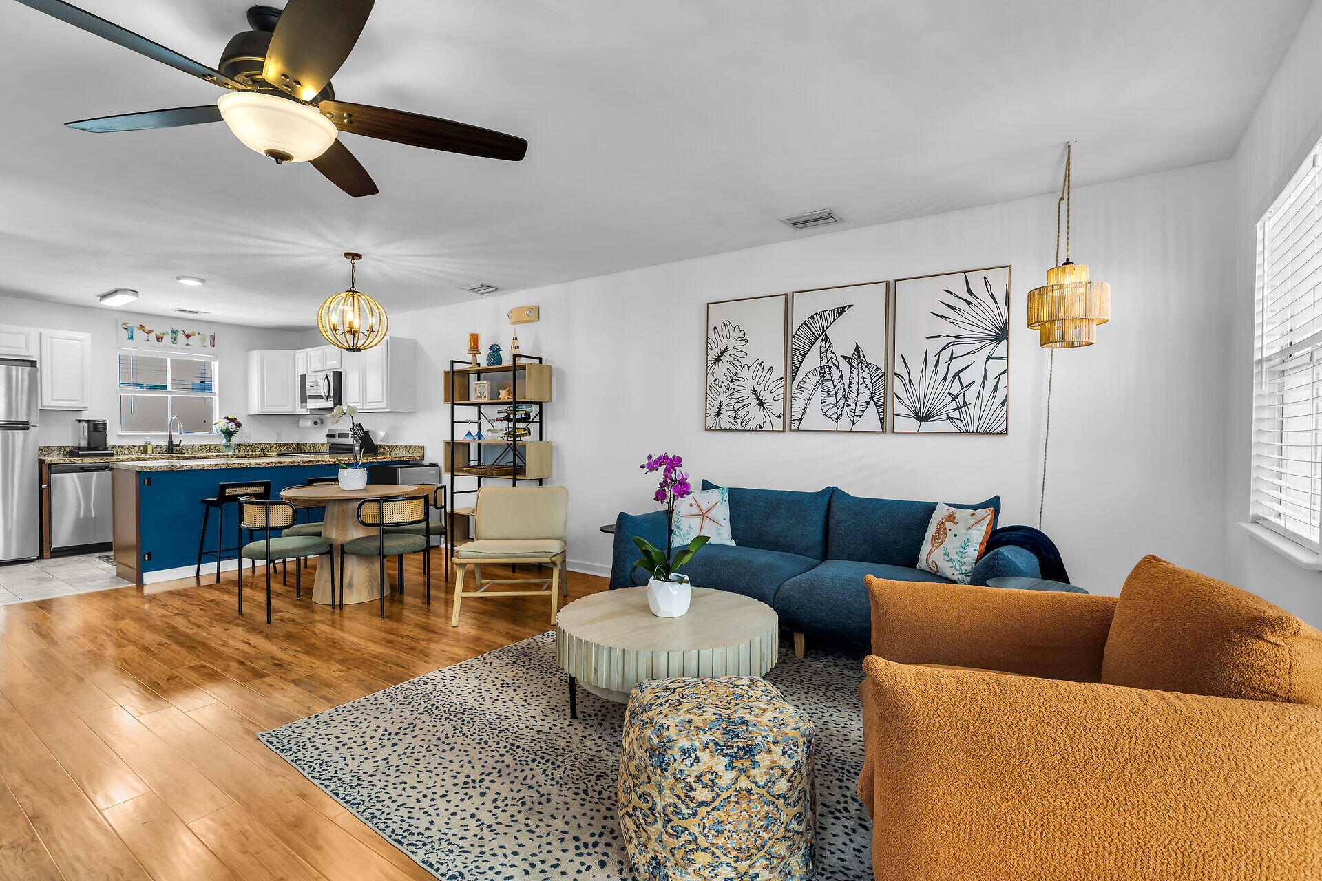 1075 Duval Street, Unit R10 Key West, FL 33040 - Photo 22 of 38 a living room with furniture kitchen view and a chandelier