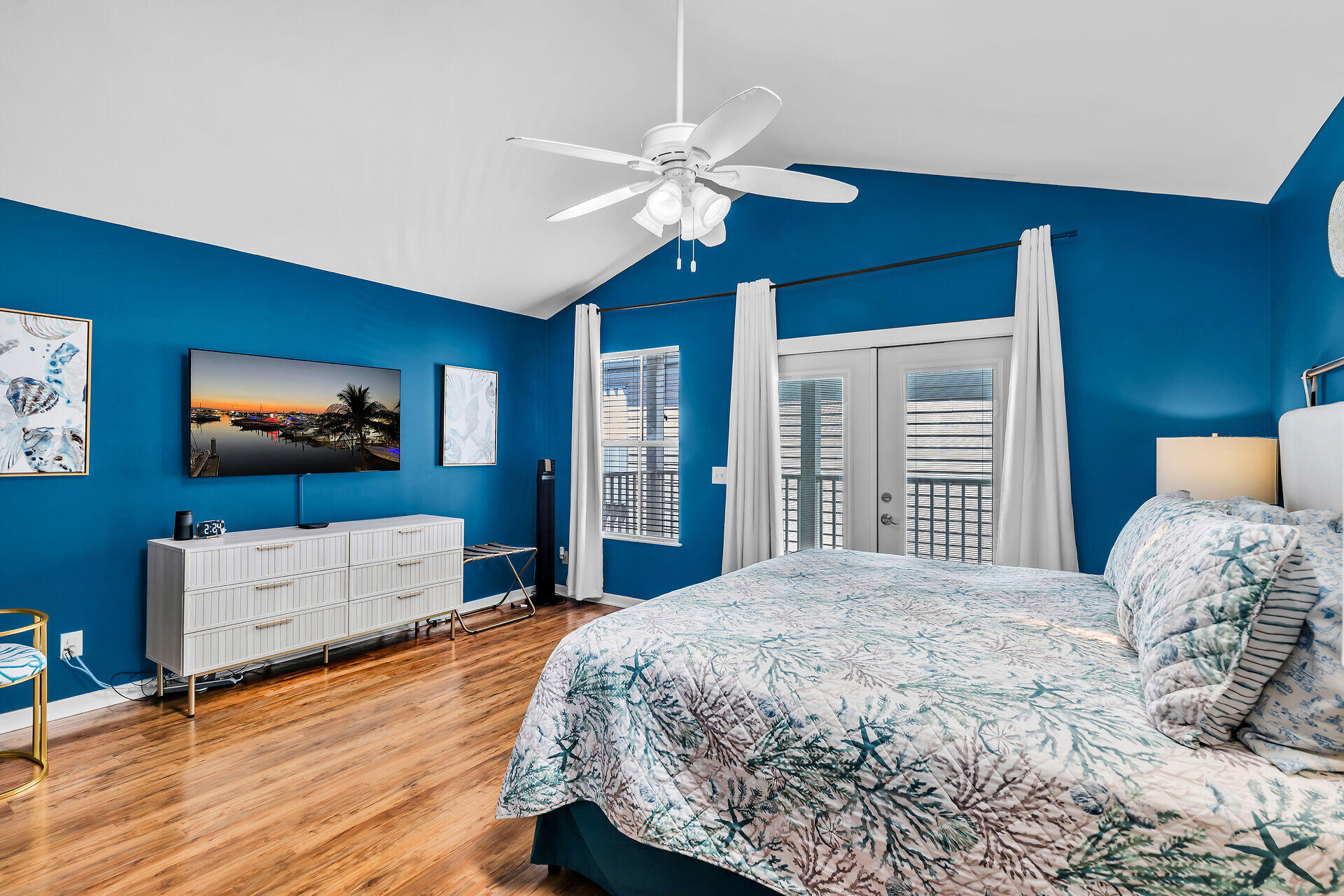 1075 Duval Street, Unit R10 Key West, FL 33040 - Photo 25 of 38 a bedroom with a bed and a flat screen tv