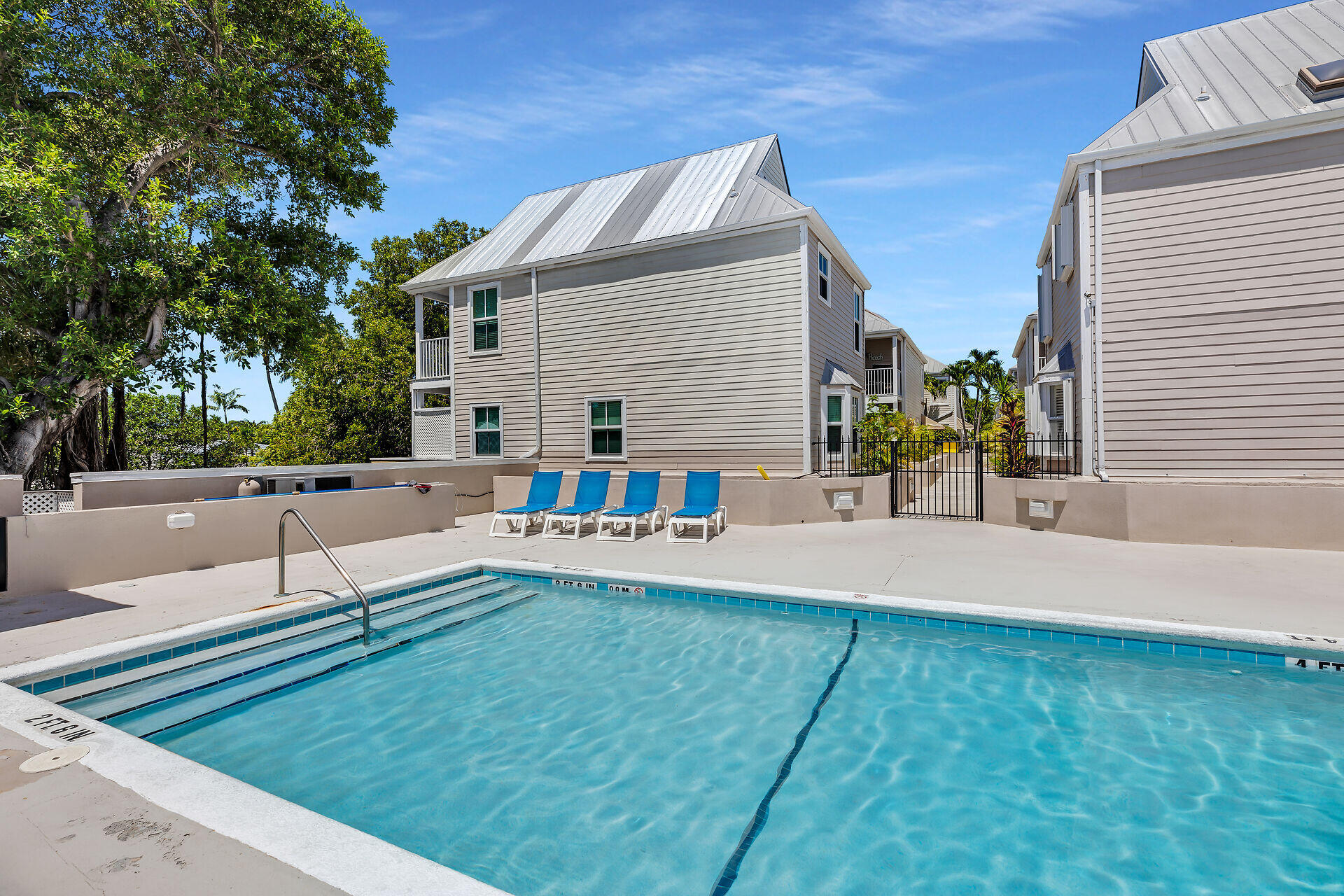 1075 Duval Street, Unit R10 Key West, FL 33040 - Photo 30 of 38 a house view with a sitting space and garden