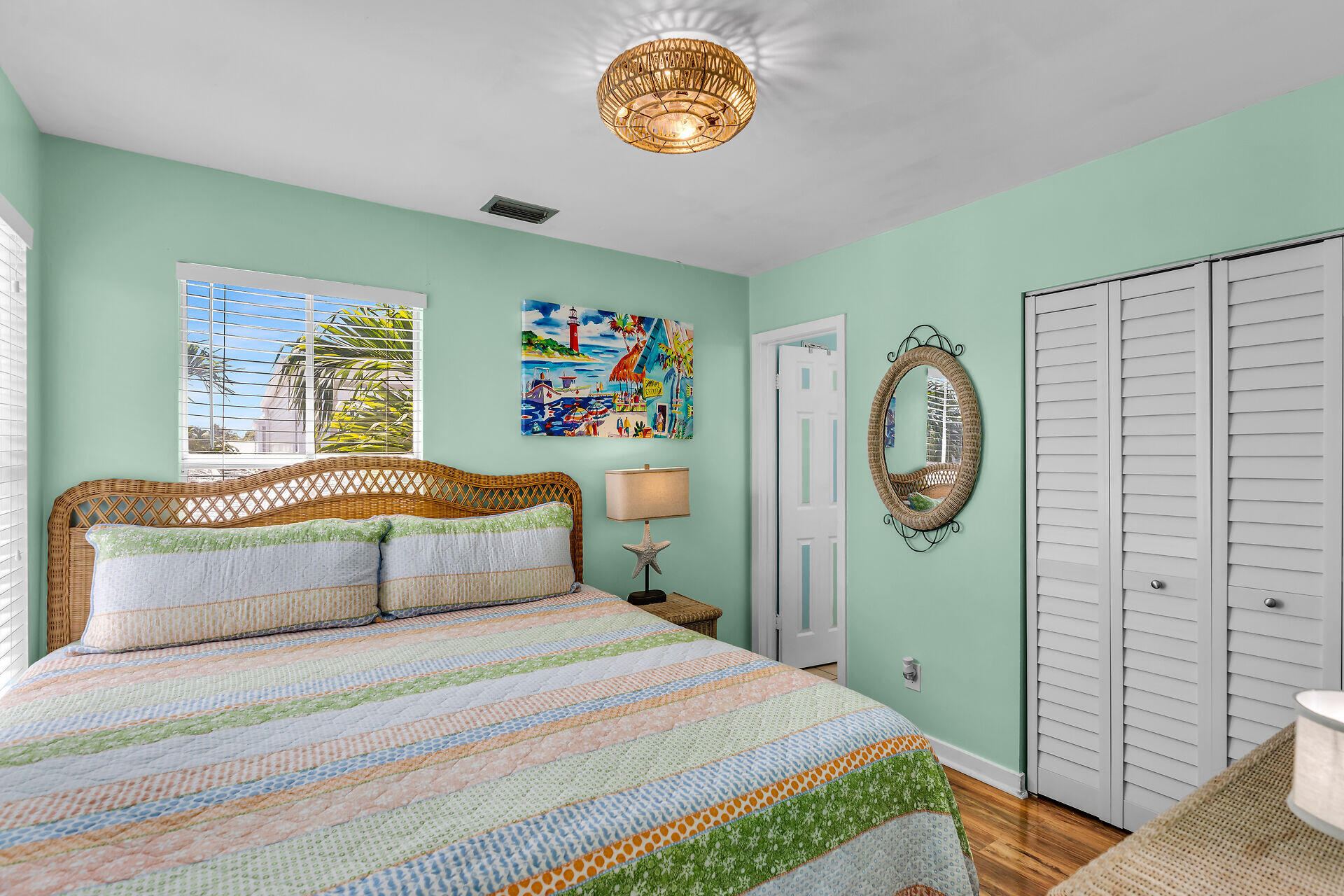1075 Duval Street, Unit R10 Key West, FL 33040 - Photo 6 of 38 a bedroom with a bed and a window