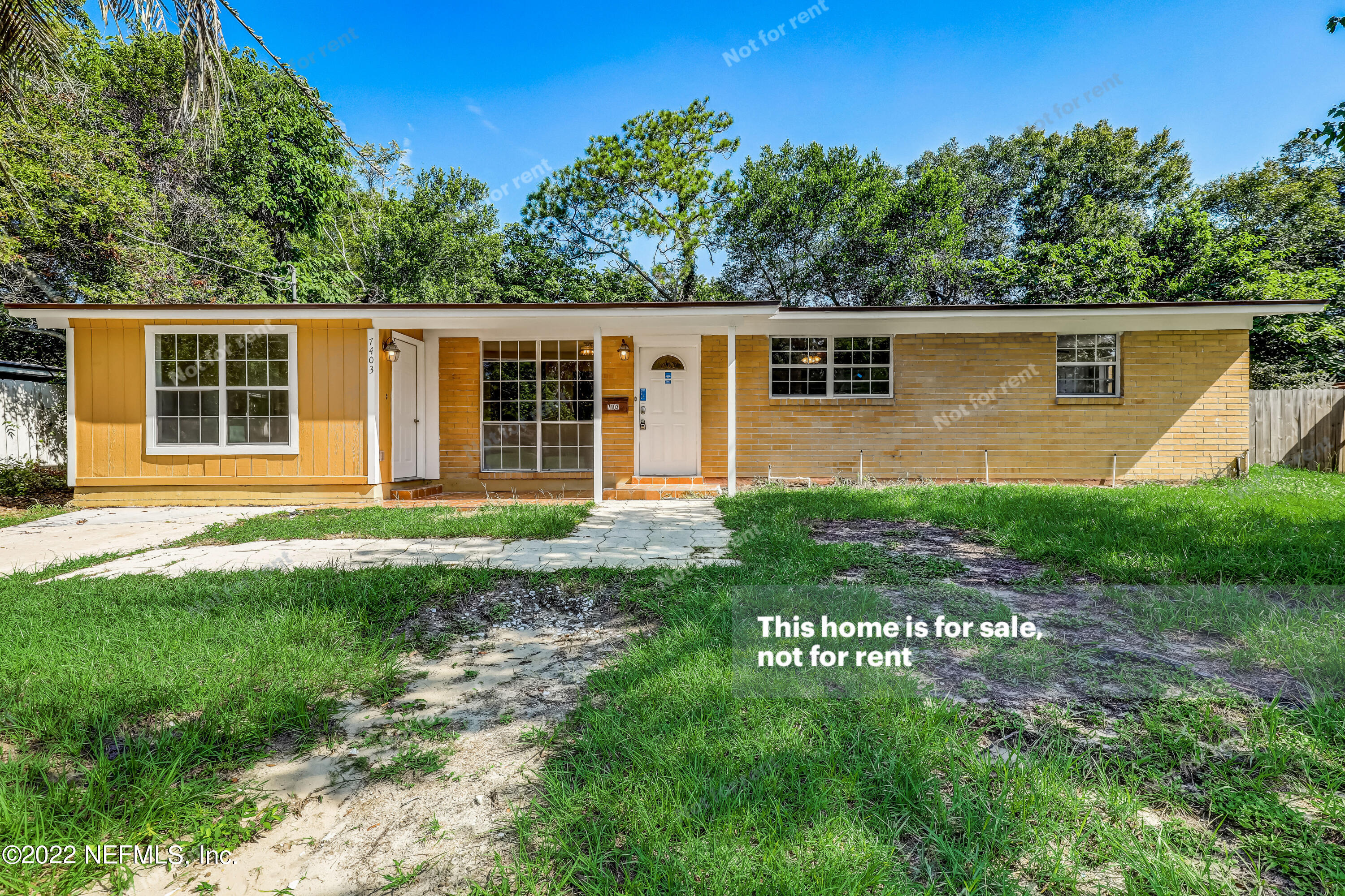 7403 Sandhurst Road South Jacksonville, FL 32277 - Photo 1 of 29 a view of a house with a yard