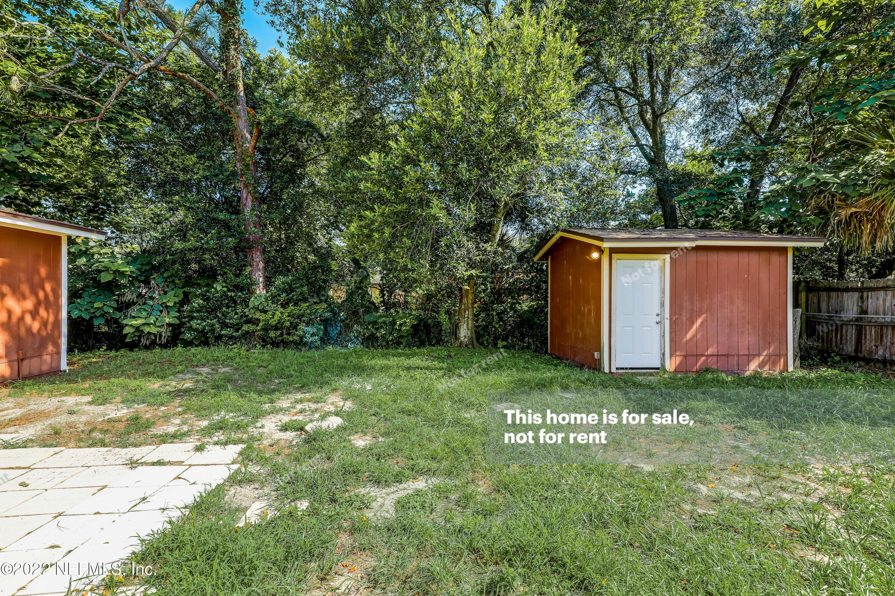 7403 Sandhurst Road South Jacksonville, FL 32277 - Photo 28 of 29 a backyard of a house with lots of green space