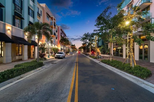 a view of a street with a building in the background