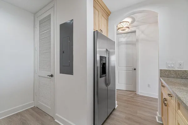 a view of a kitchen from the hallway