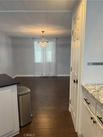 a kitchen with a refrigerator and a sink