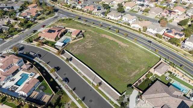 an aerial view of a residential apartment building with a yard