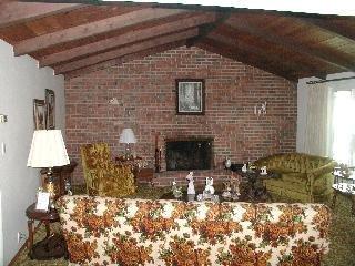 535 Los Alamos Road Santa Rosa, CA 95409 - Photo 5 of 8 a stone house with a yard and garage
