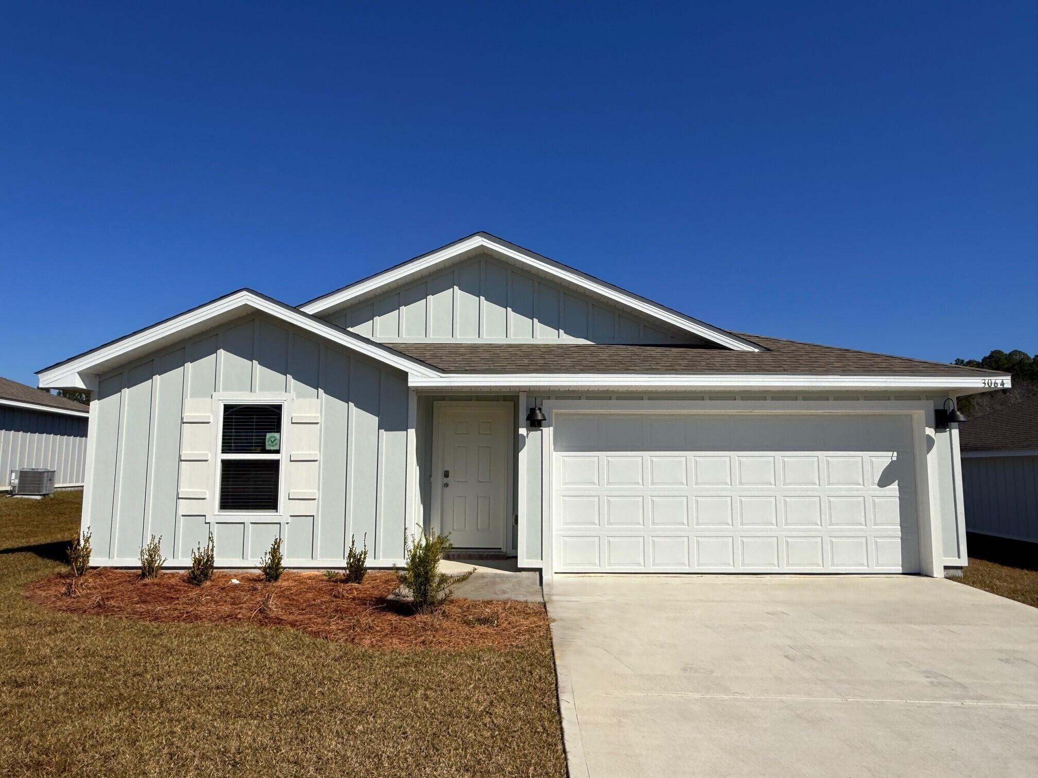 a front view of a house with a garage