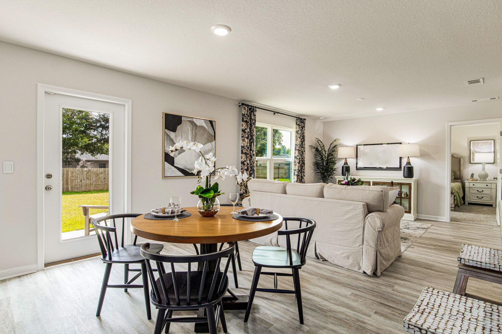 3064 Jane Lane Crestview, FL 32539 - Photo 3 of 33 a dining room with furniture and wooden floor