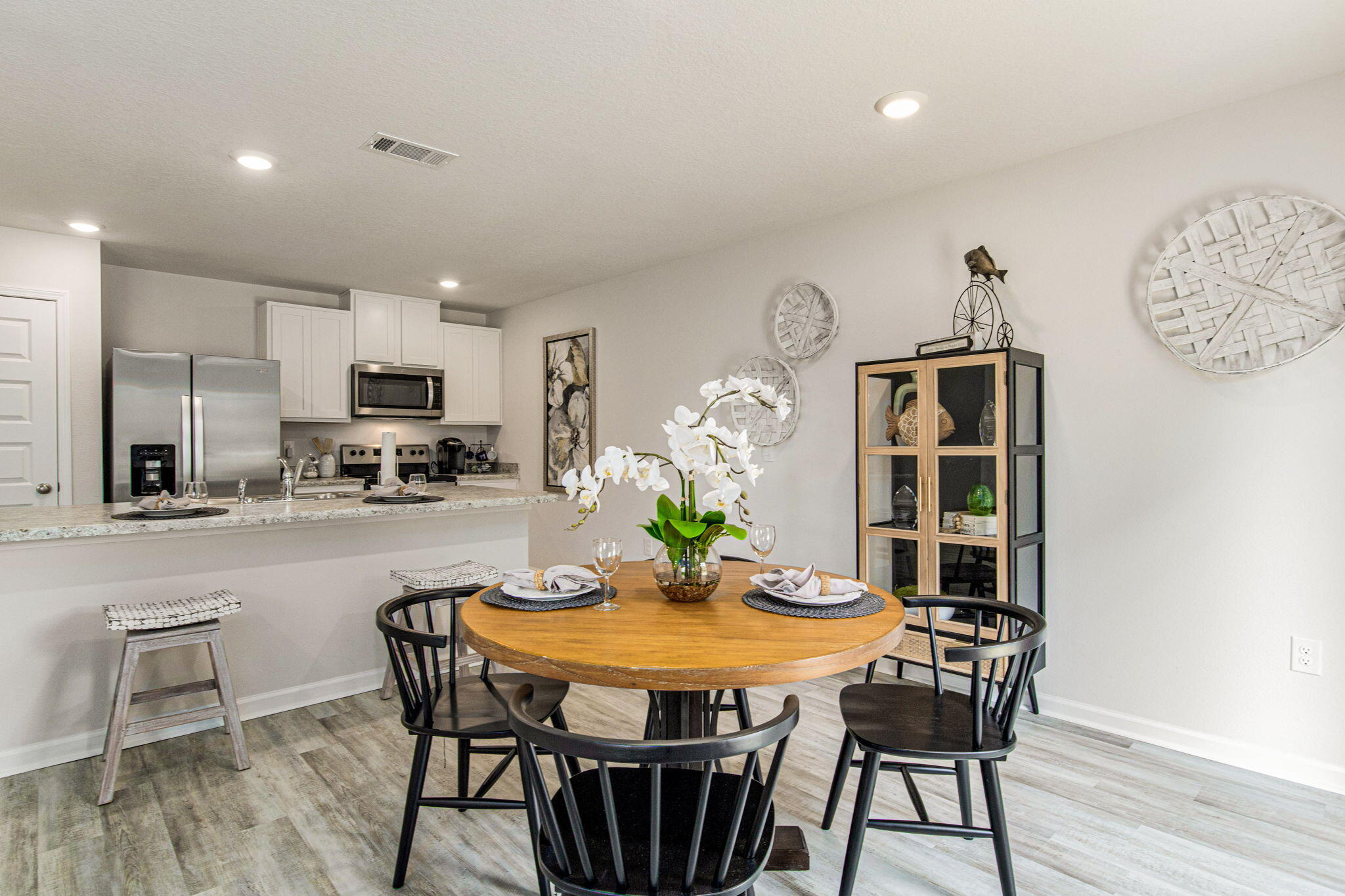 3064 Jane Lane Crestview, FL 32539 - Photo 4 of 33 a view of a dining room with furniture and wooden floor