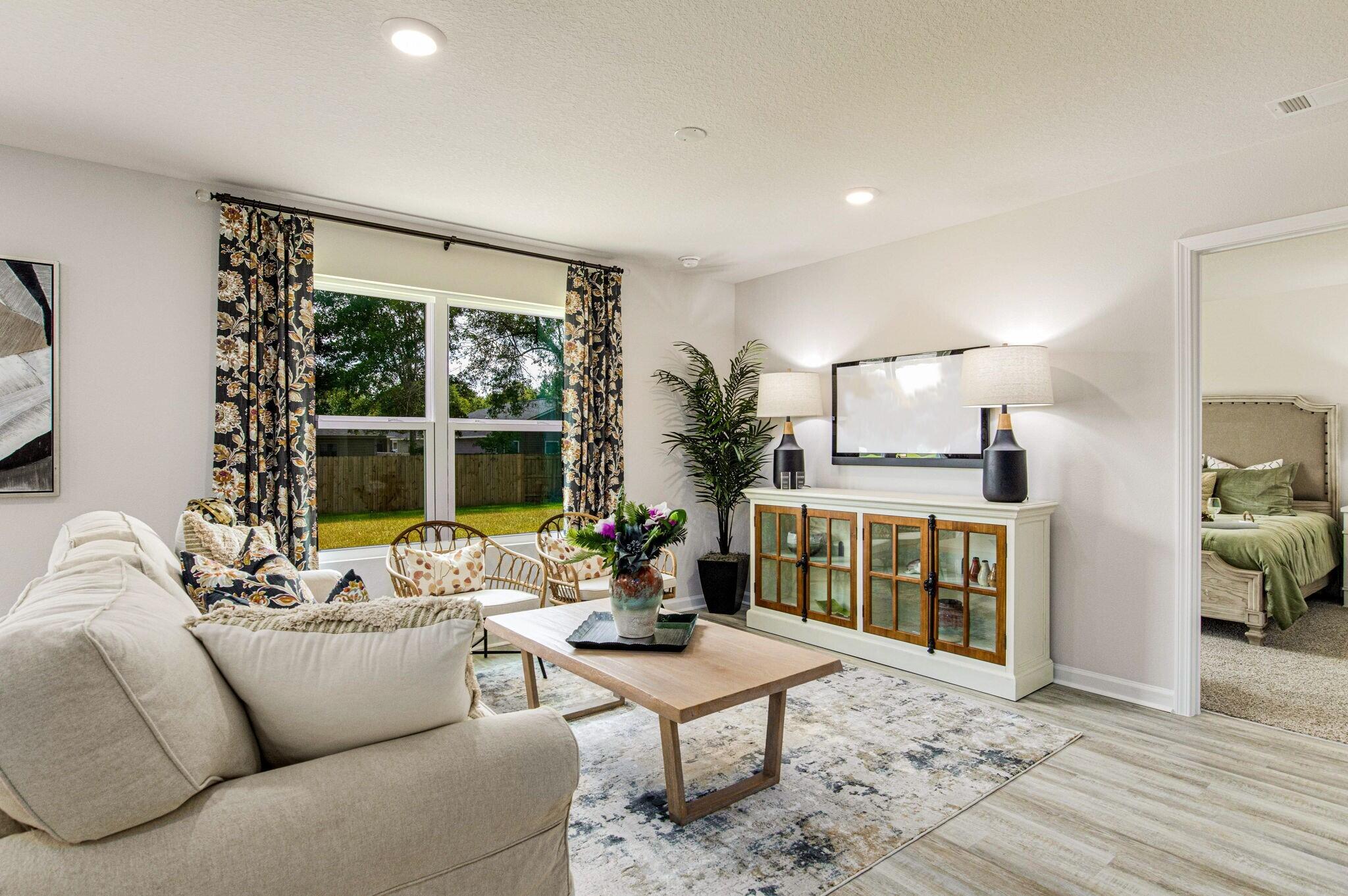 3064 Jane Lane Crestview, FL 32539 - Photo 9 of 33 a living room with furniture and a large window