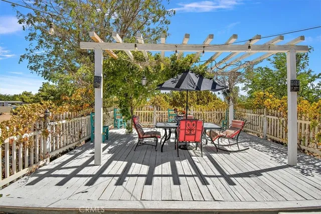 a view of a chairs and table on the terrace