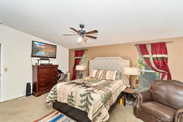 a bedroom with a bed and dresser