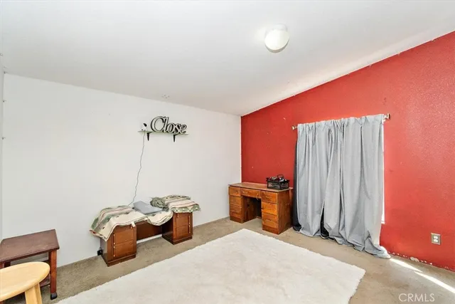 a bedroom with furniture and natural light