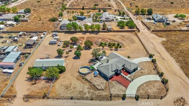 an aerial view of a house with outdoor space