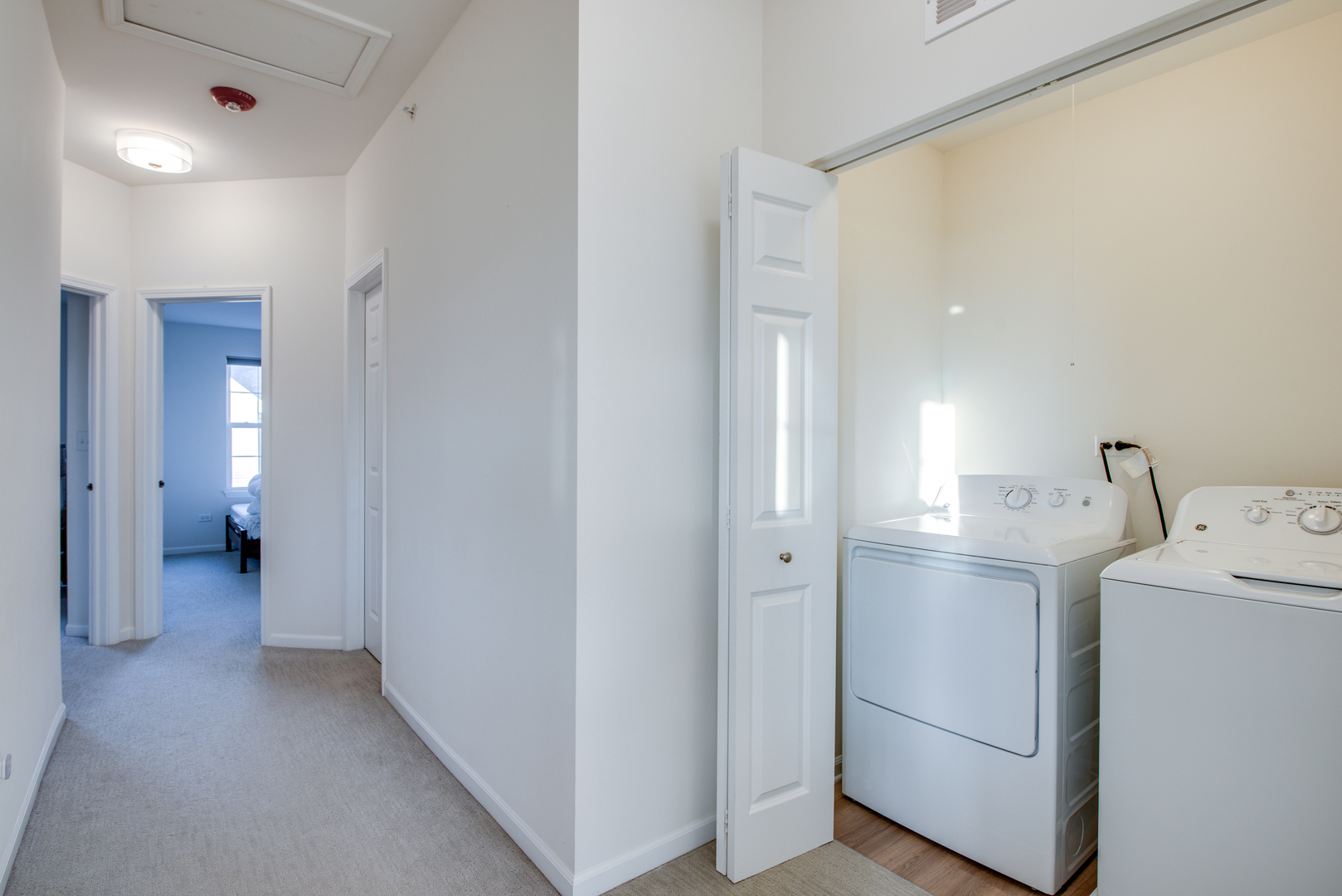 4477 Monroe Court Naperville, IL 60564 - Photo 19 of 23 a view of a hallway with bathroom and sink