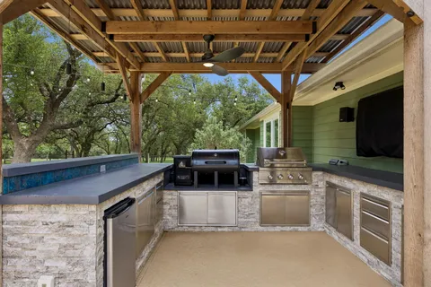 a kitchen with a stove a sink and a microwave