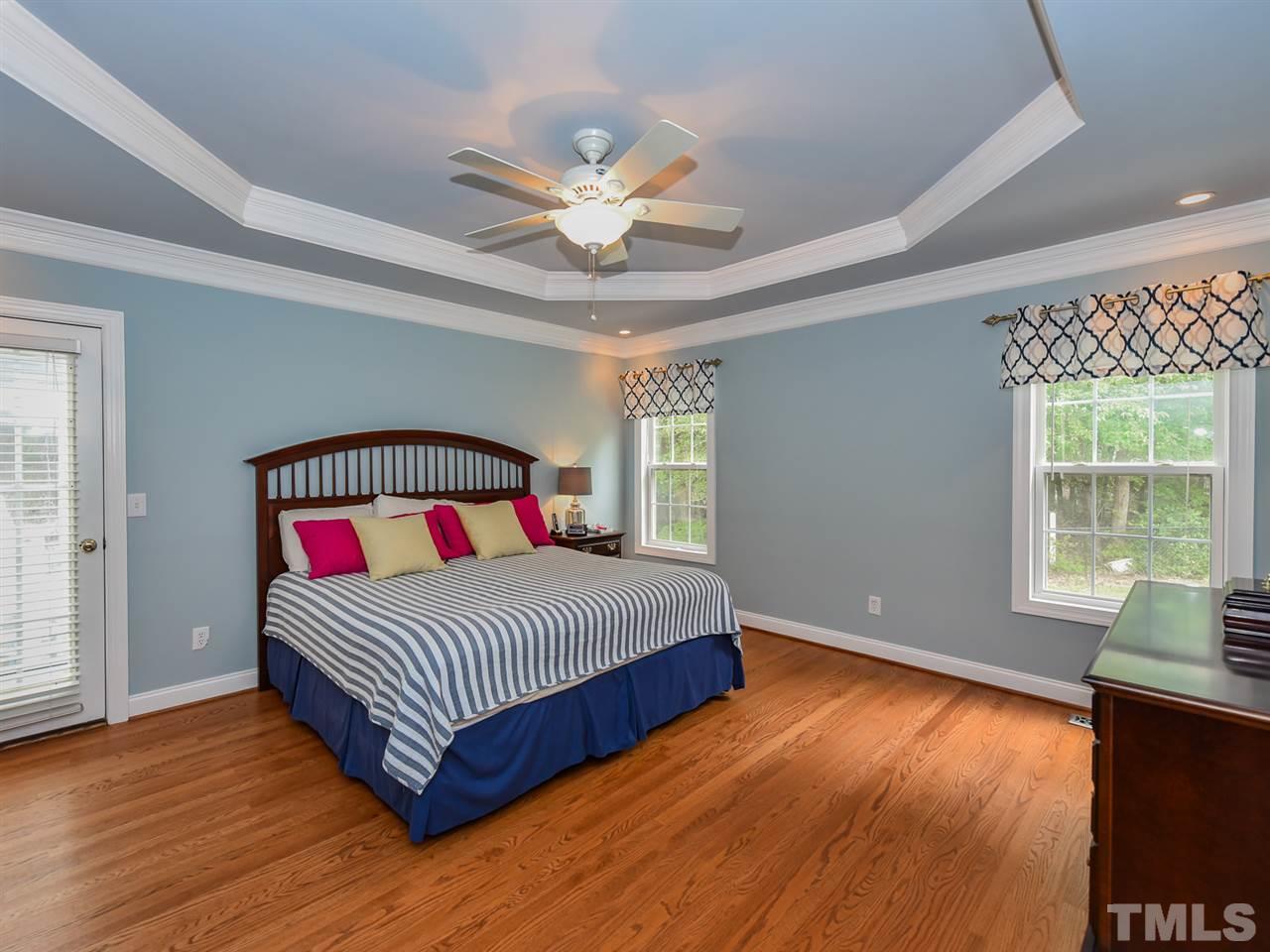 6005 Maton Place Raleigh, NC 27603 - Photo 13 of 30 a bedroom with a bed and window
