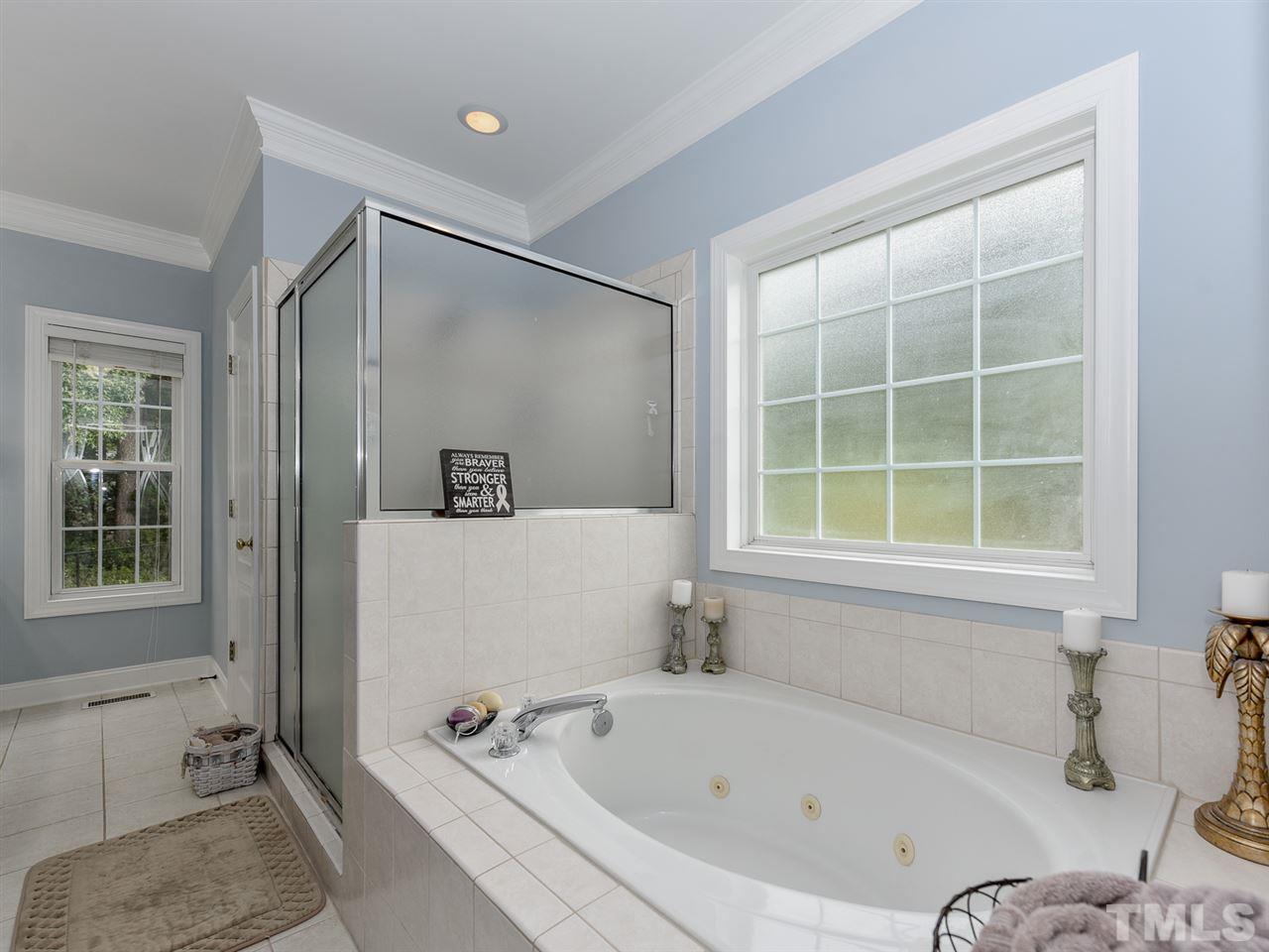 6005 Maton Place Raleigh, NC 27603 - Photo 14 of 30 a bathroom with a tub and a window