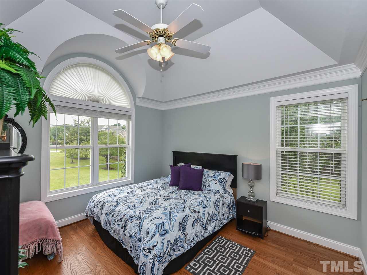 6005 Maton Place Raleigh, NC 27603 - Photo 16 of 30 a bedroom with a large bed and a large window