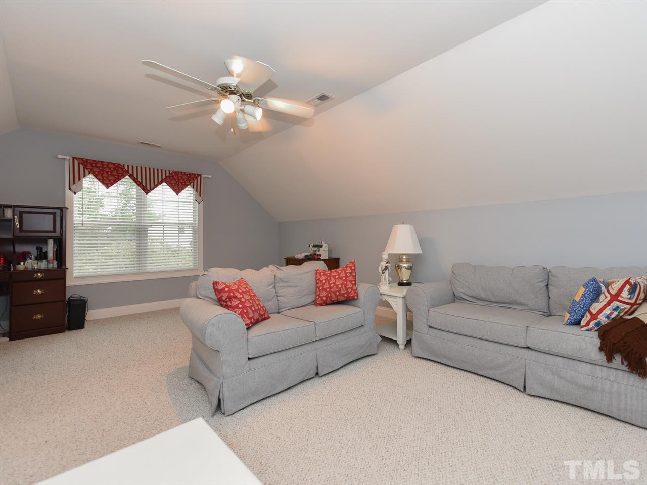 6005 Maton Place Raleigh, NC 27603 - Photo 19 of 30 a living room with furniture and a large window