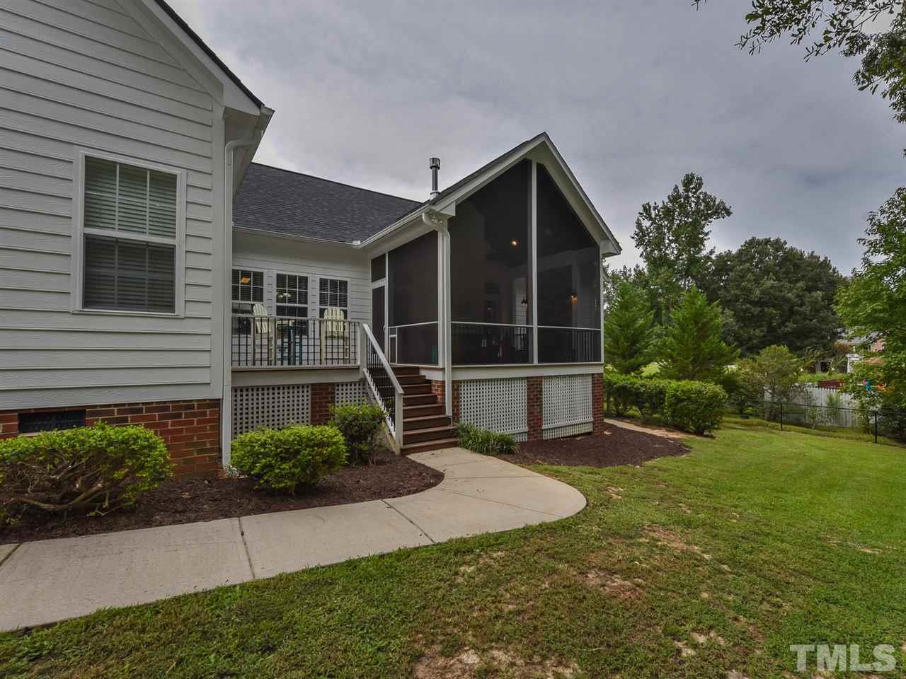6005 Maton Place Raleigh, NC 27603 - Photo 21 of 30 a view of a house with backyard and garden