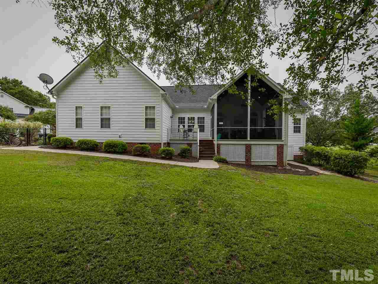 6005 Maton Place Raleigh, NC 27603 - Photo 22 of 30 a front view of house with yard and green space