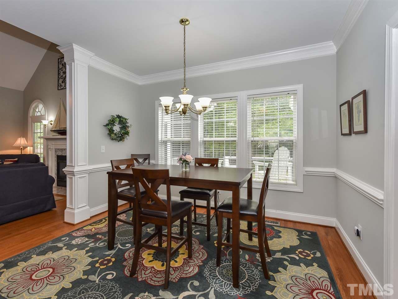 6005 Maton Place Raleigh, NC 27603 - Photo 9 of 30 a view of a dining room with furniture window and wooden floor