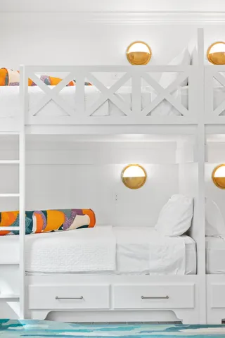 a kitchen with stainless steel appliances kitchen island a table and chairs in it