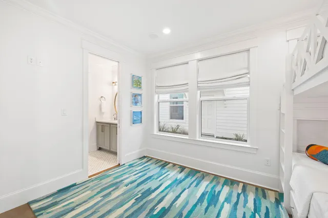 a view of kitchen with stainless steel appliances granite countertop a stove and a fireplace