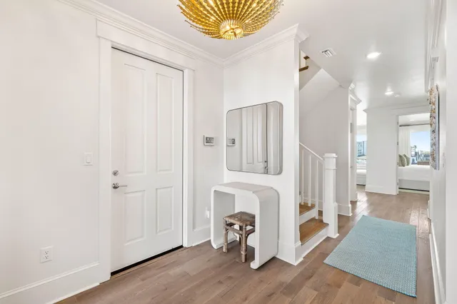 a view of a lake with lawn chairs