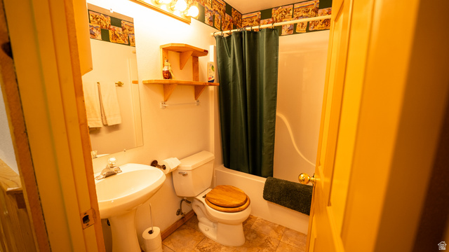 7500 Spring Canyon Road Helper, UT 84526 - Photo 28 of 64 Bathroom featuring a pedestal sink, a toilet with a wood-finish seat, a shower/tub combination, and tiled flooring