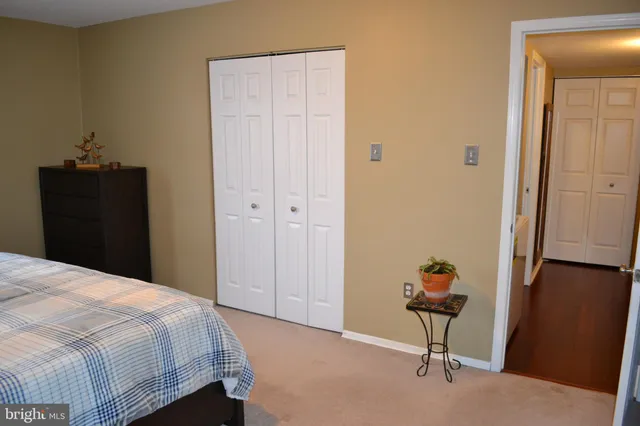 a bedroom with a bed and a table