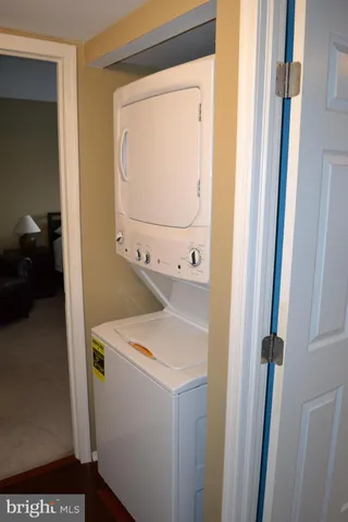 a utility room with a sink dryer and washer