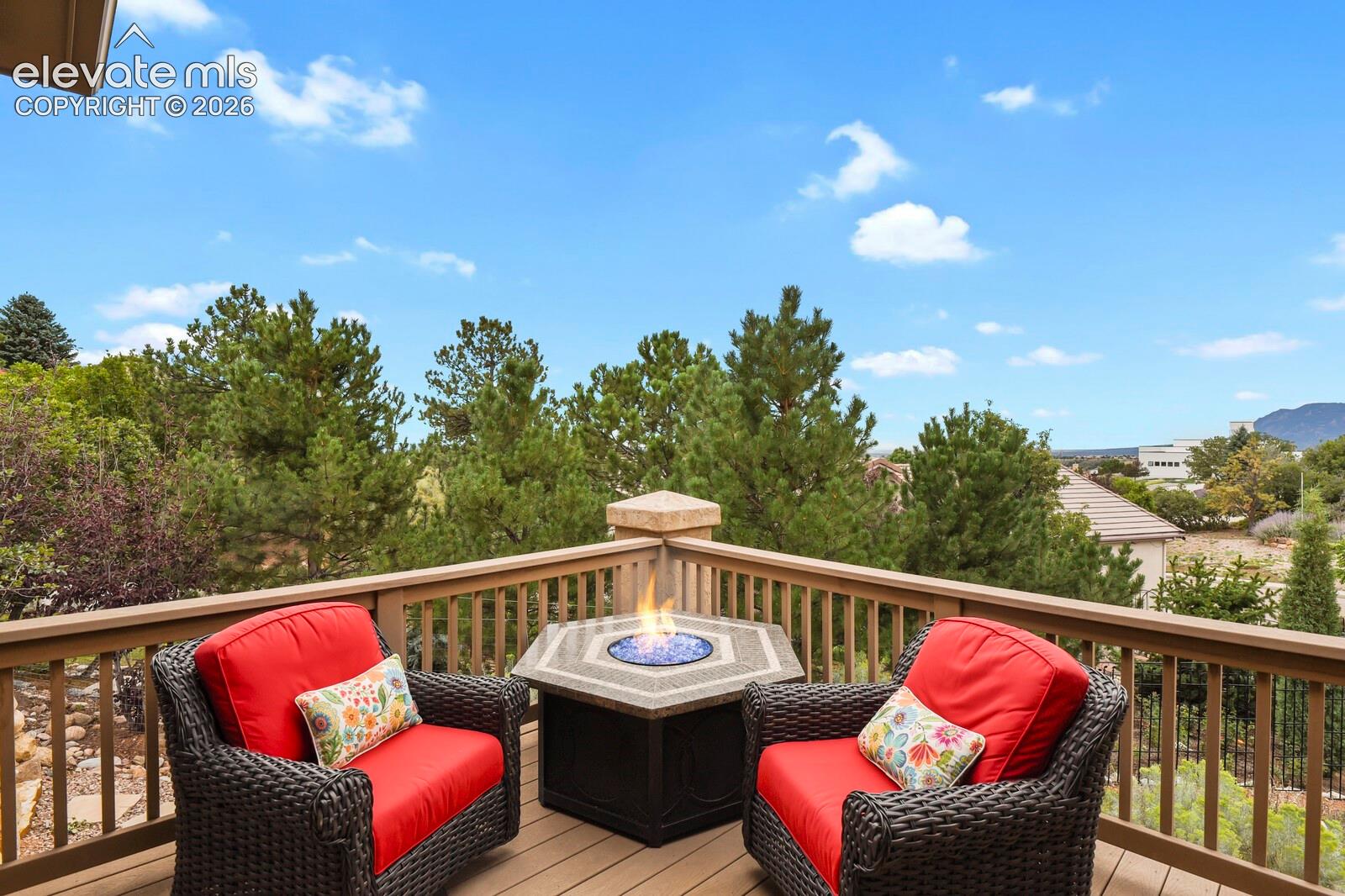 5545 Wilson Road Colorado Springs, CO 80919 - Photo 34 of 48 Expansive deck surrounded by mature trees and mountain/city views