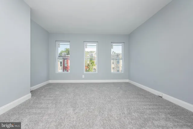 an empty room with windows