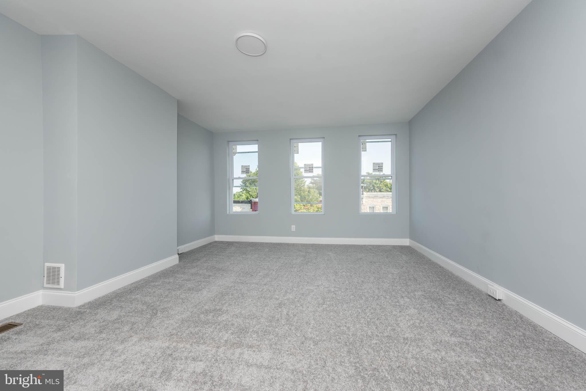 1909 Harlem Avenue Baltimore, MD 21217 - Photo 20 of 27 an empty room with windows and entrance