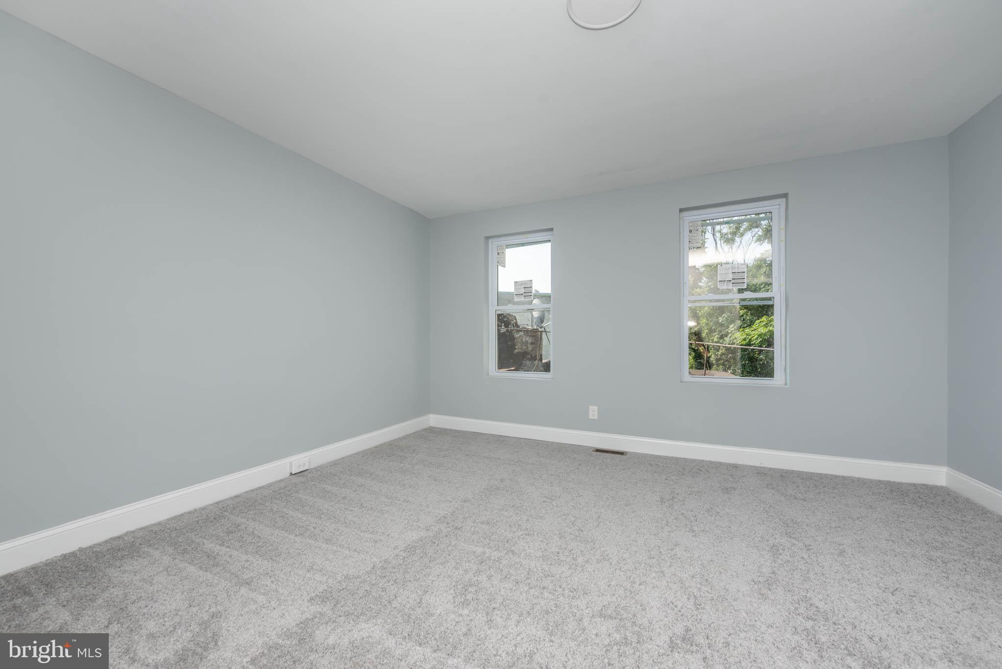 1909 Harlem Avenue Baltimore, MD 21217 - Photo 22 of 27 an empty room with windows