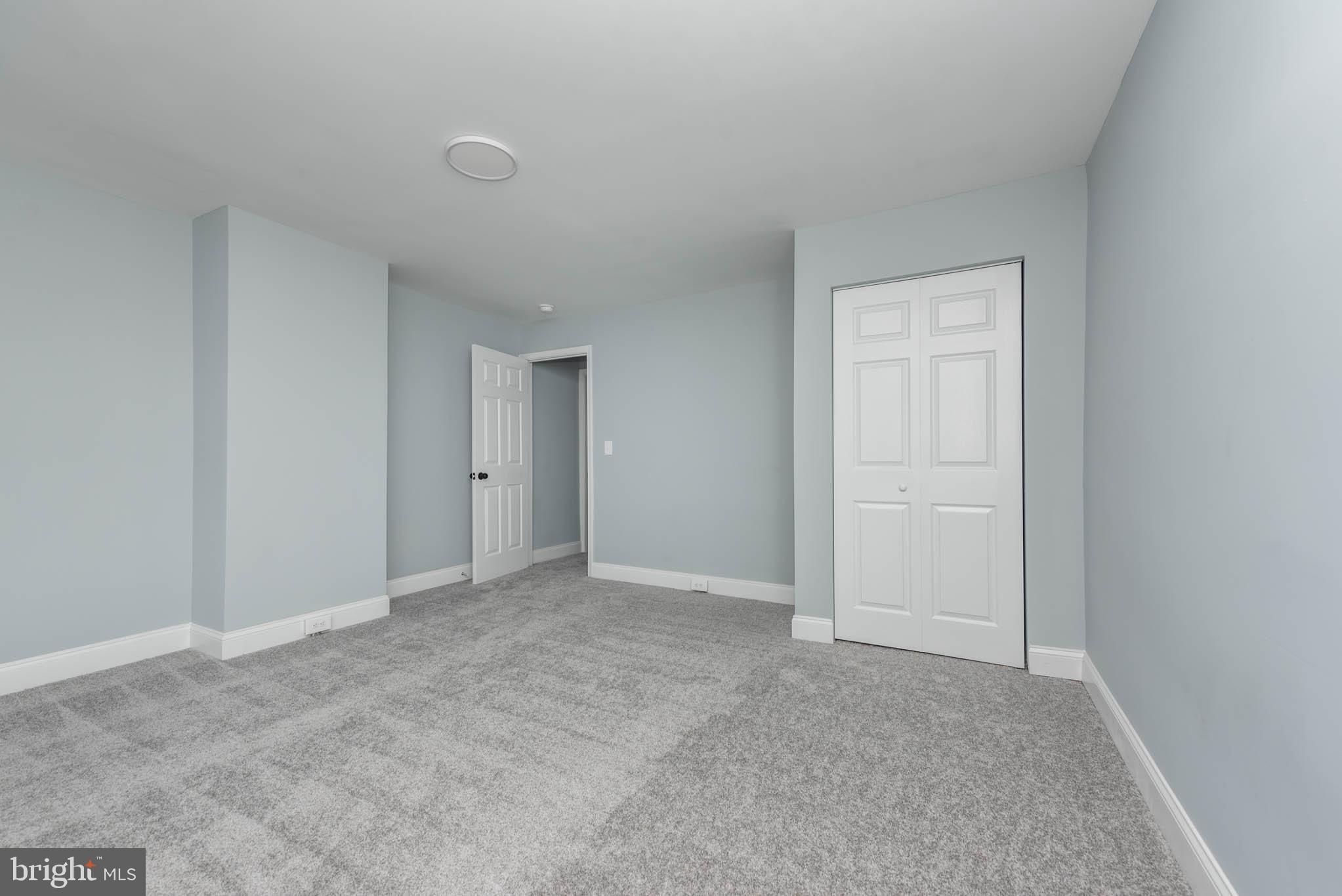 1909 Harlem Avenue Baltimore, MD 21217 - Photo 23 of 27 a view of an empty room and chandelier fan