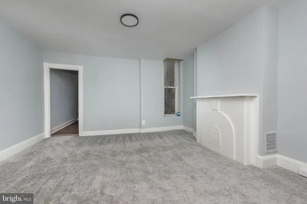 an entryway with ceiling fan