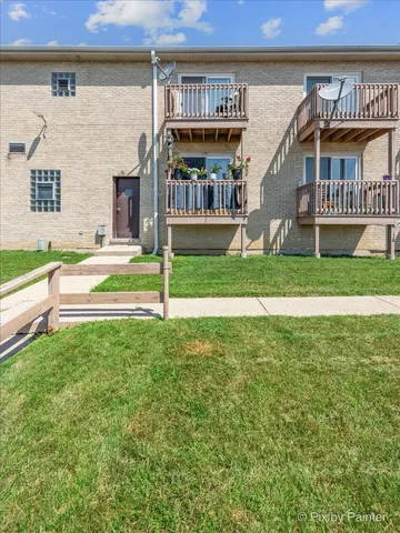 a view of a garden with lawn chairs