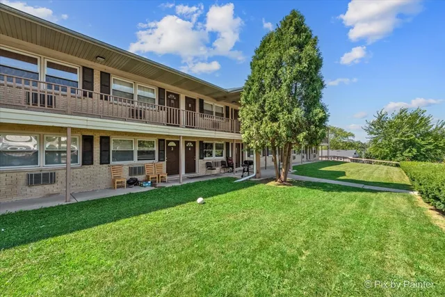 a view of a building with a yard