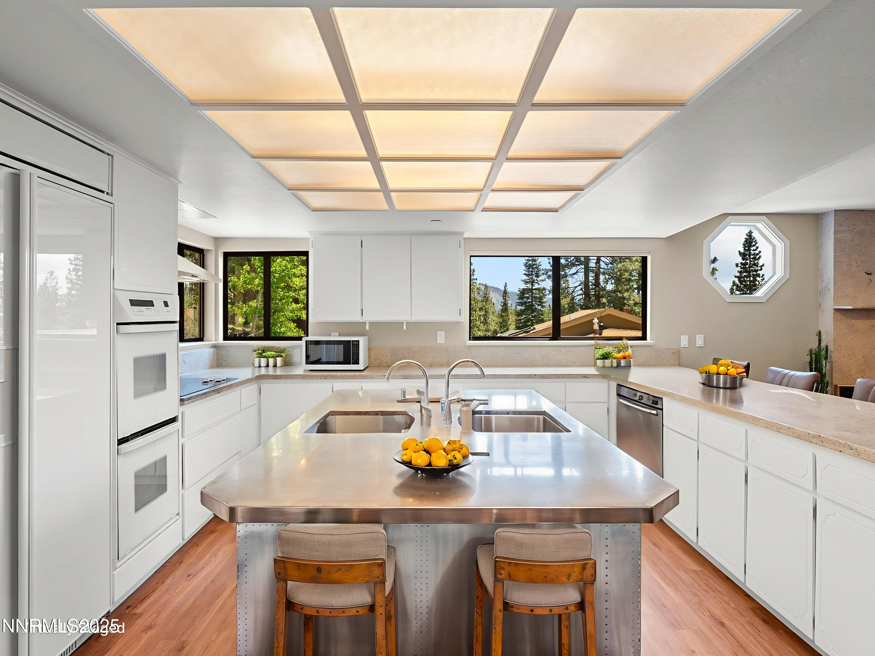 315 Paiute Drive Stateline, NV 89449 - Photo 12 of 77 a kitchen with a table chairs and refrigerator