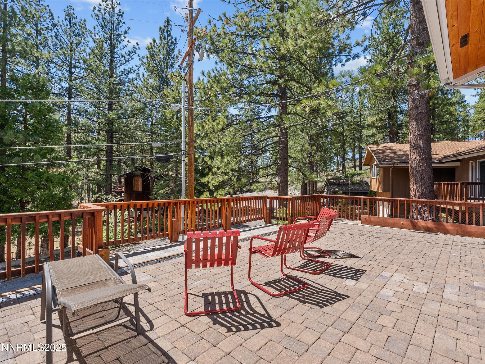 315 Paiute Drive Stateline, NV 89449 - Photo 22 of 77 a roof deck with table and chairs and potted plants