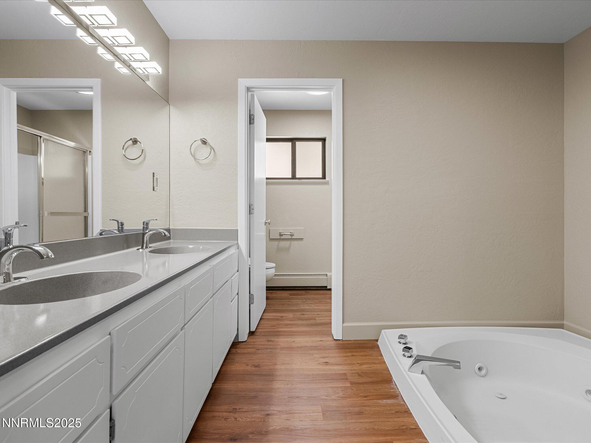 315 Paiute Drive Stateline, NV 89449 - Photo 29 of 77 a spacious bathroom with a double vanity sink and a large mirror