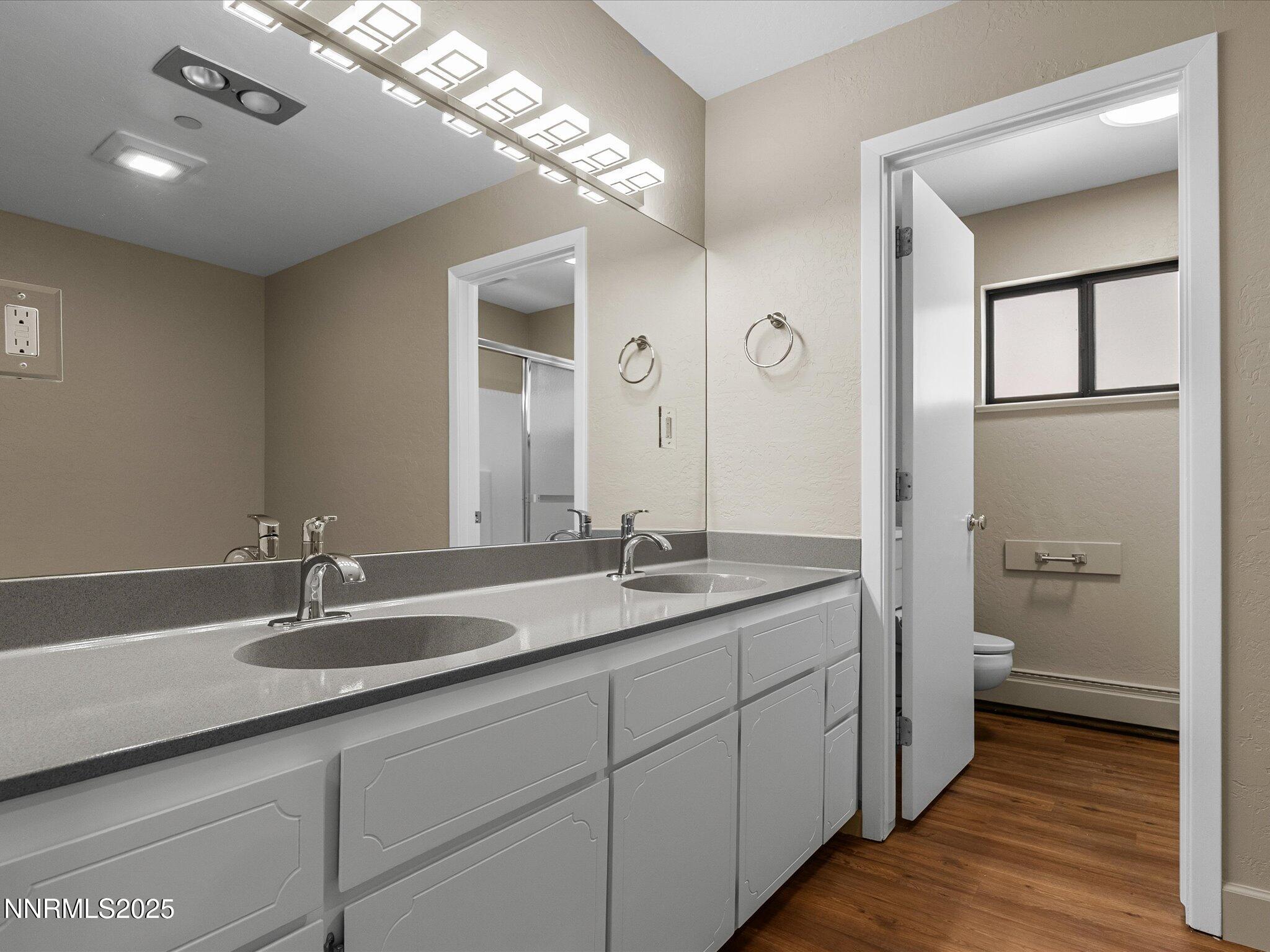 315 Paiute Drive Stateline, NV 89449 - Photo 31 of 77 a bathroom with a double vanity sink and a mirror