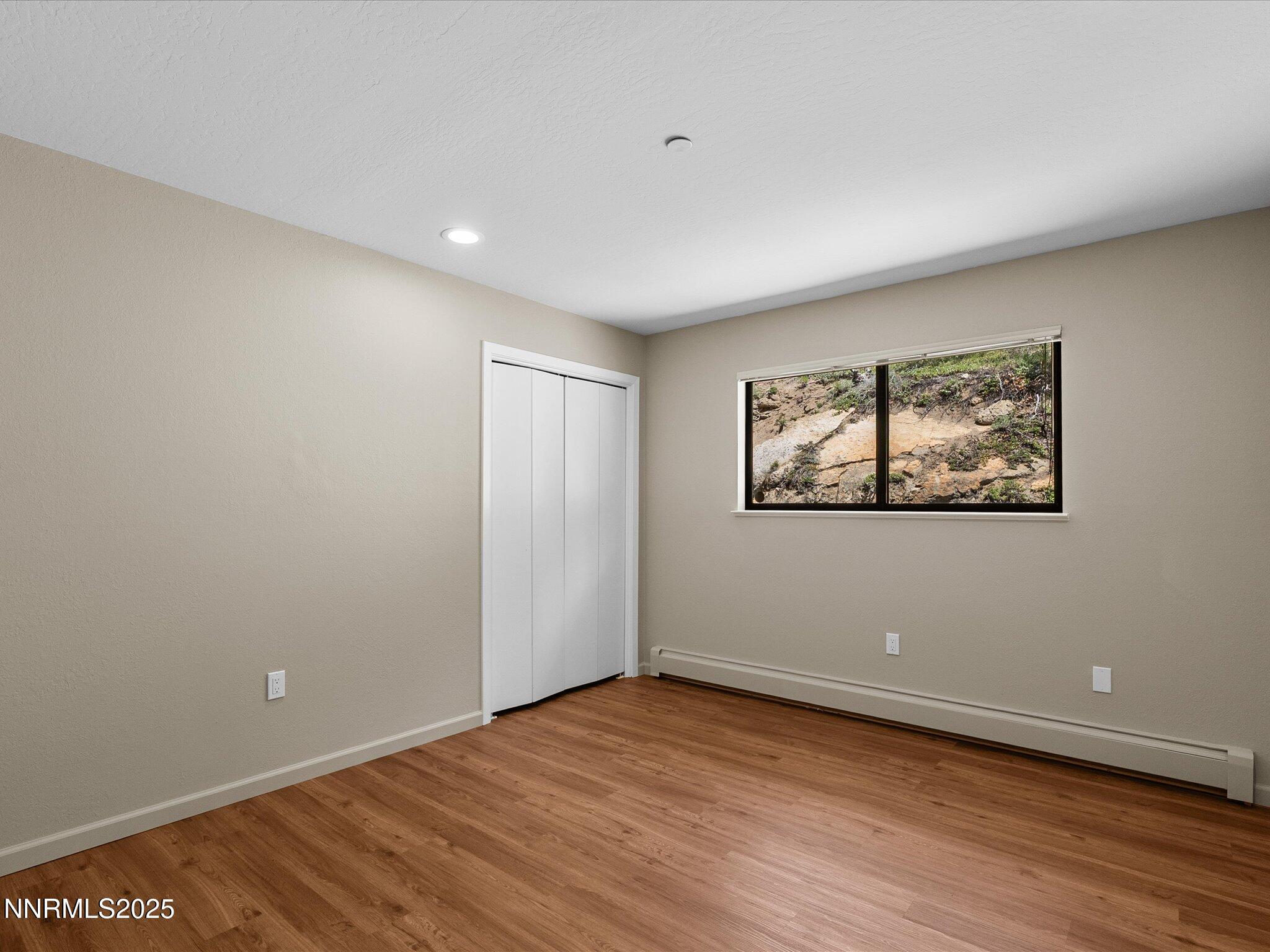 315 Paiute Drive Stateline, NV 89449 - Photo 35 of 77 a view of an empty room with wooden floor and a window