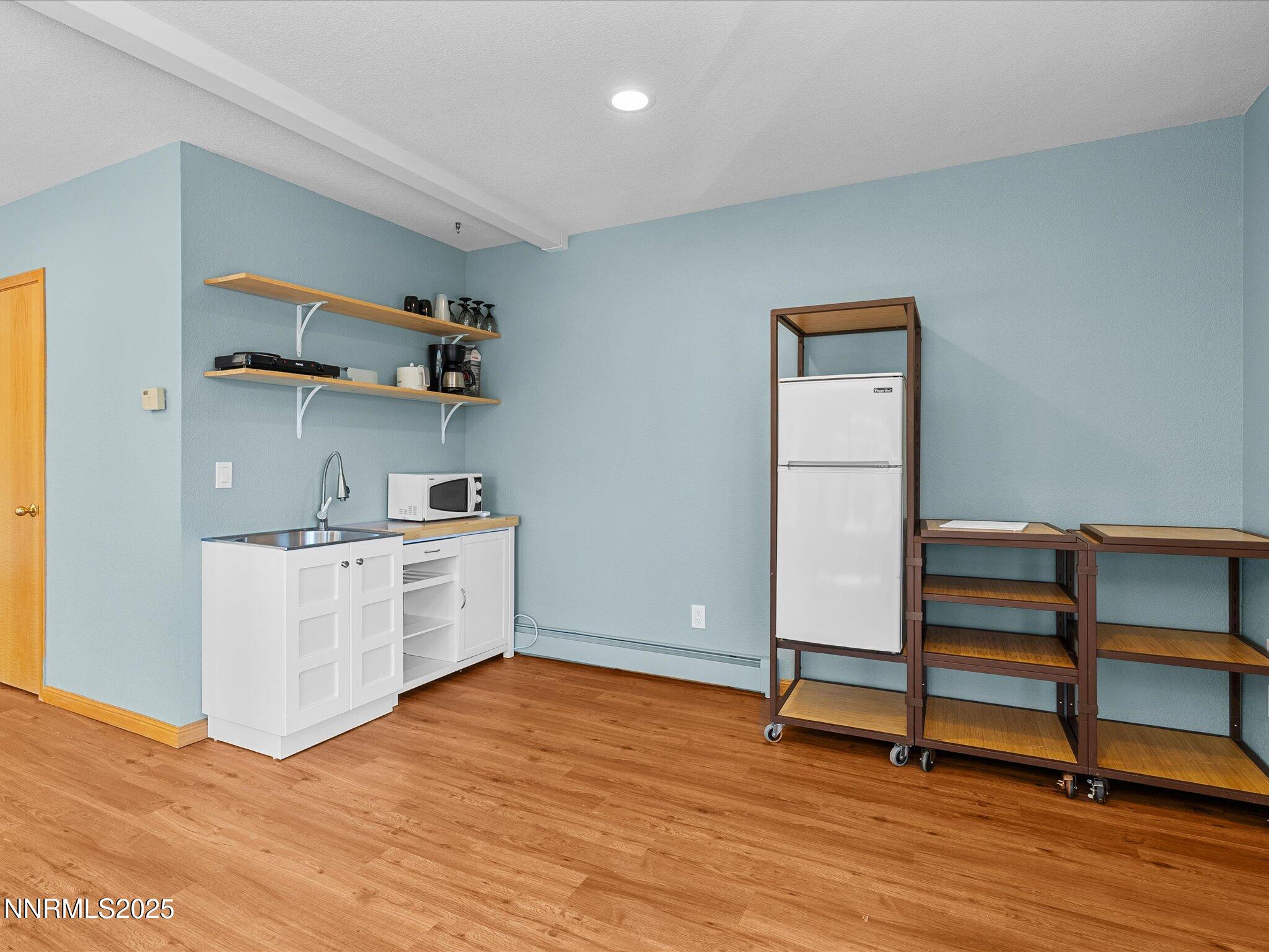 315 Paiute Drive Stateline, NV 89449 - Photo 56 of 77 a view of kitchen with wooden floor and electronic appliances