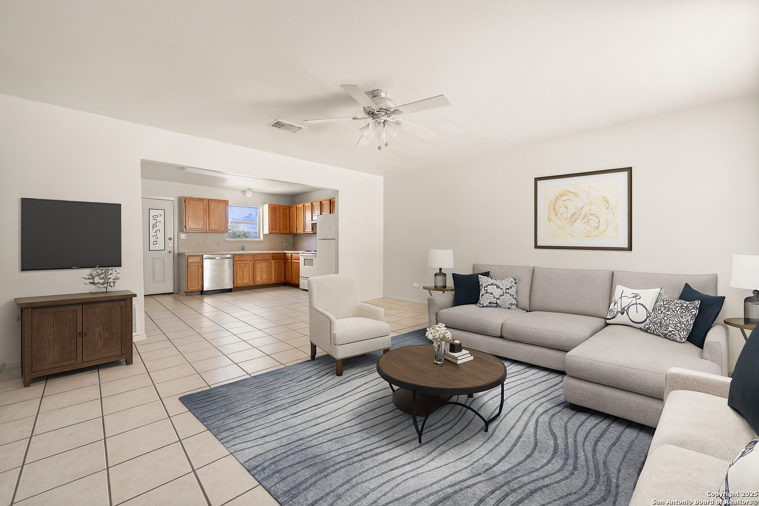 a living room with furniture and a flat screen tv